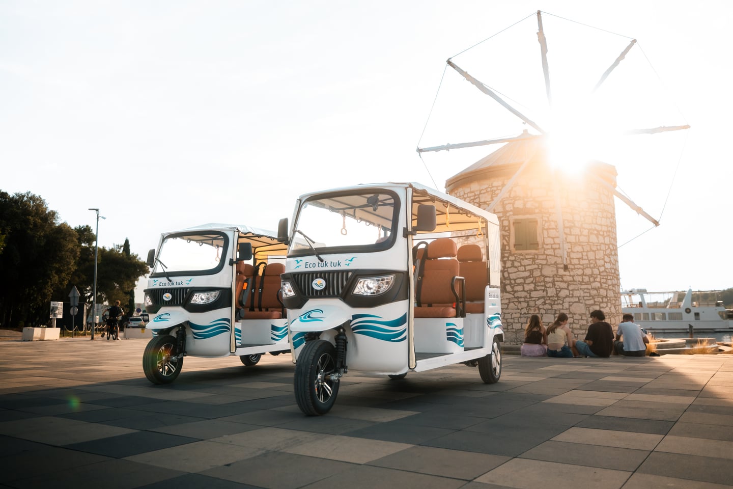 Electric tuk-tuk on Medulin coastal road with Adriatic Sea view