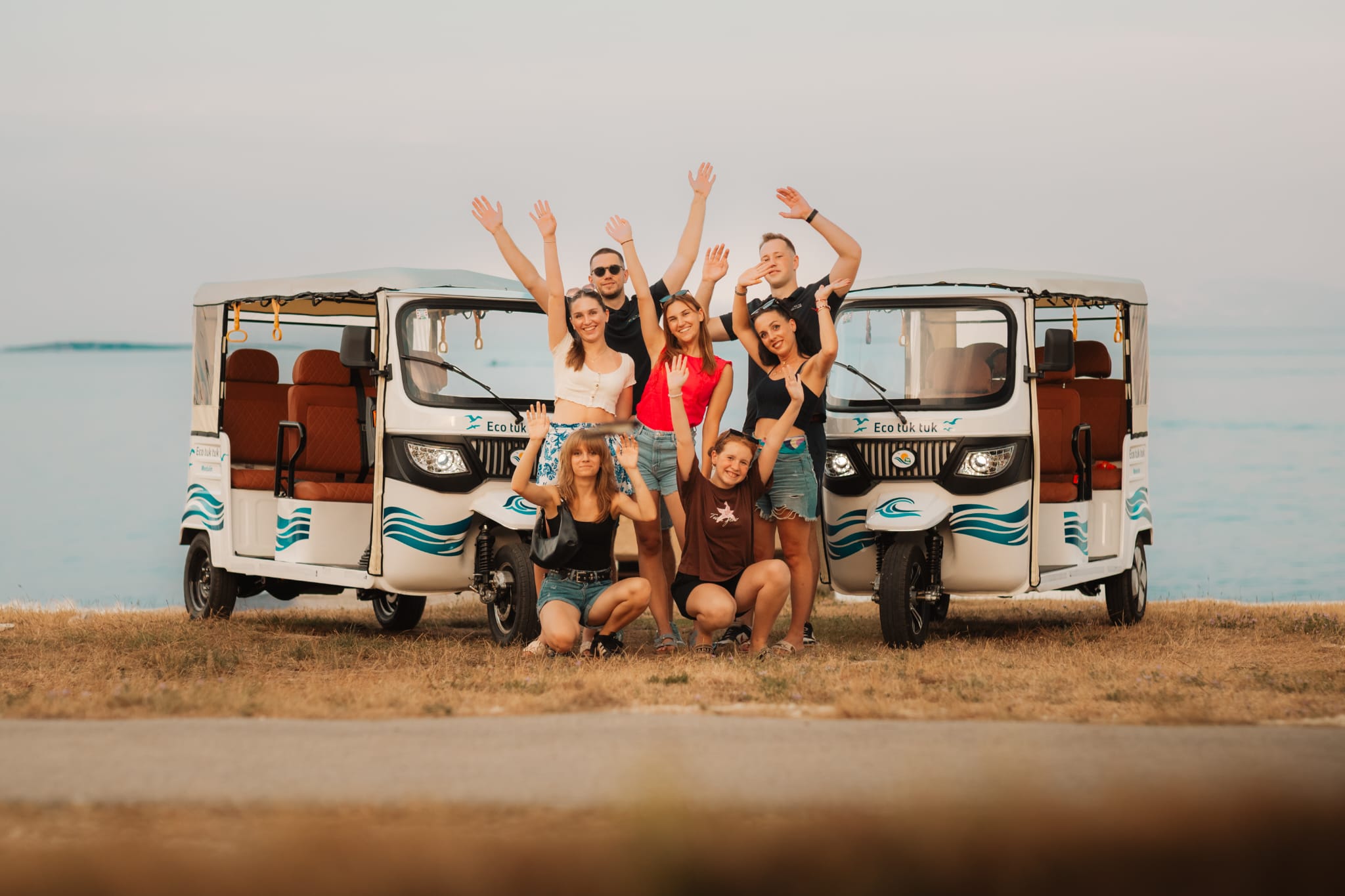 The Eco Tuk Tuk crew with both tuk-tuks above Medulin Bay