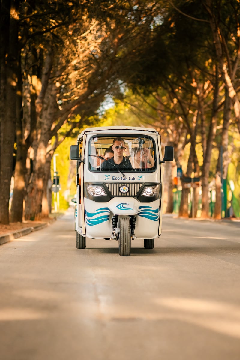 Happy family enjoying tuk-tuk tour with Medulin old town and coastline views